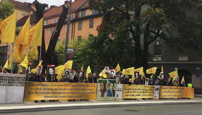 Tuesday, September 28, 2021 — Stockholm: Freedom-loving Iranians, supporters of the People's Mojahedin Organization of Iran(MEK/PMOI), gathered outside the court of the executioner Hamid Noury.