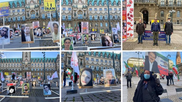 November 5, 2021 — Germany, Hamburg: Freedom-loving Iranians, MEK supporters held a Photo exhibition of the martyrs of the 1988 massacre and the martyrs of the November 2019 uprising in front of the Hamburg State Parliament building on the anniversary of the November uprising.