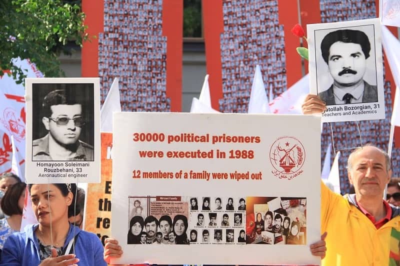 Freedom-loving Iranians, MEK supporters and relatives of the 1988 massacre martyrs, rally in front of the court of the executioner Hamid Noury - file photo