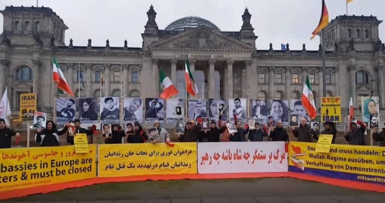 Berlin—November 16, 2022: Freedom-loving Iranians and supporters of the People's Mojahedin Organization of Iran (PMOI/MEK) continue to sit-in and rally in front of the Bundestag in solidarity with the Iranian people's uprising and political prisoners. They also commemorated the anniversary of the November 2019 uprising in Iran.