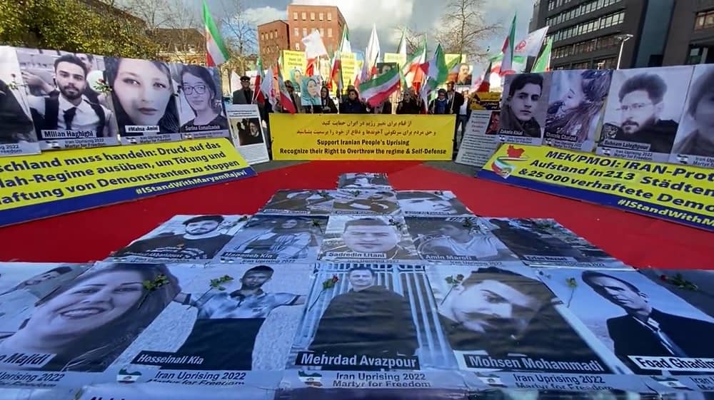 Münster, Germany—November 4, 2022: Freedom-loving Iranians and supporters of the People’s Mojahedin Organization of Iran (PMOI/MEK) held a gathering and photo exhibition of the Iranian nationwide protests martyrs in solidarity with the Iranian people’s uprising.