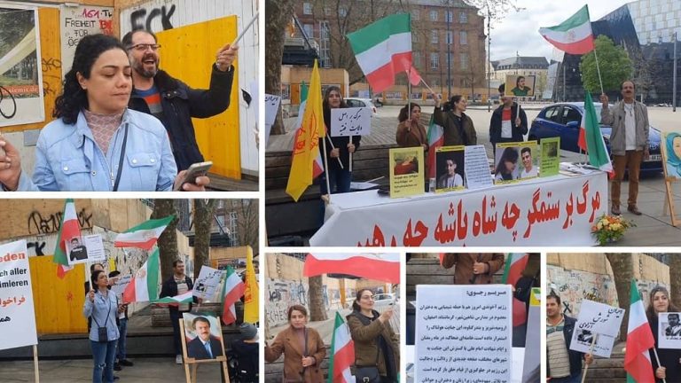 Freiburg, Germany—April 19, 2023: Freedom-loving Iranians and supporters of the People's Mojahedin Organization of Iran (PMOI/MEK) held a rally in support of the nationwide Iranian Revolution.