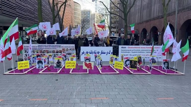 Hamburg, Germany—April 6, 2023: Freedom-loving Iranians, supporters of the People's Mojahedin Organization of Iran (PMOI/MEK) held a rally and photo exhibition of the martyrs of the nationwide protests killed by the mullahs' regime in solidarity with the Iranian Revolution.