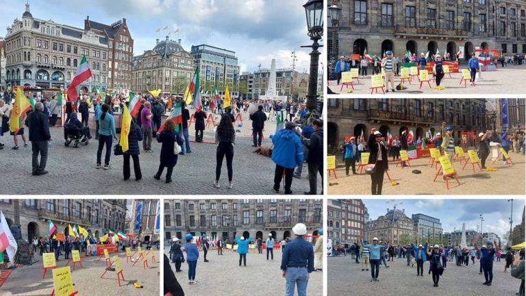 Amsterdam, The Netherlands—May 6, 2023: Freedom-loving Iranians, supporters of the People’s Mojahedin Organization of Iran (PMOI/MEK) rallied in Dam square in support of the Iran Revolution and expressed their solidarity with the Iranian workers' strike across the country.