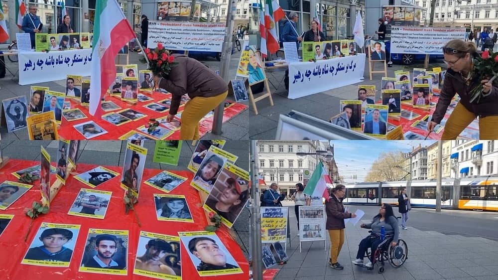 Heidelberg, Germany—April 29, 2023: Freedom-loving Iranians, supporters of the People's Mojahedin Organization of Iran (PMOI/MEK) held a rally in solidarity with the Iranian Revolution. They celebrated International Workers' Day, and expressed their solidarity with the Iranian workers' strike across the country.