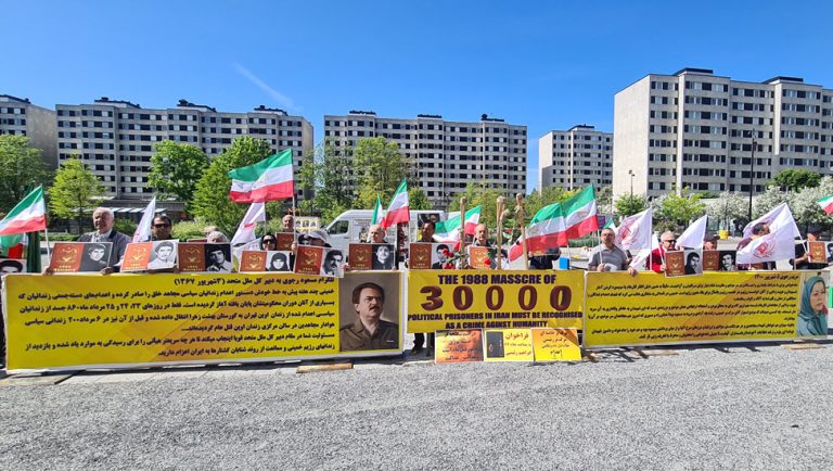 Stockholm, Sweden—May 29, 2023: Freedom-loving Iranians, and supporters of the People's Mojahedin Organization of Iran (PMOI/MEK) held a rally on the eleventh session of the appeal trial of the executioner Hamid Noury in front of the court. They are seeking justice for more than 30,000 martyrs of the 1988 massacre.
