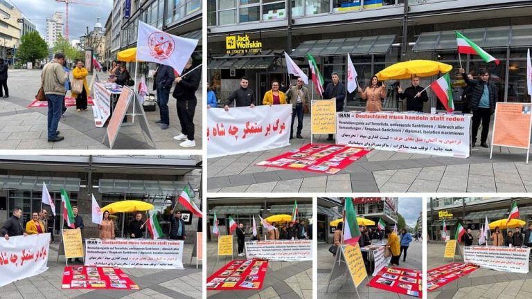 Stuttgart, Germany—May 13, 2023: Supporters of the People's Mojahedin Organization of Iran (PMOI/MEK) and freedom-loving Iranians gathered to show their solidarity with the ongoing Iranian Revolution. They Also Condemned Recent Brutal Executions in Iran by the Mullahs' Regime.
