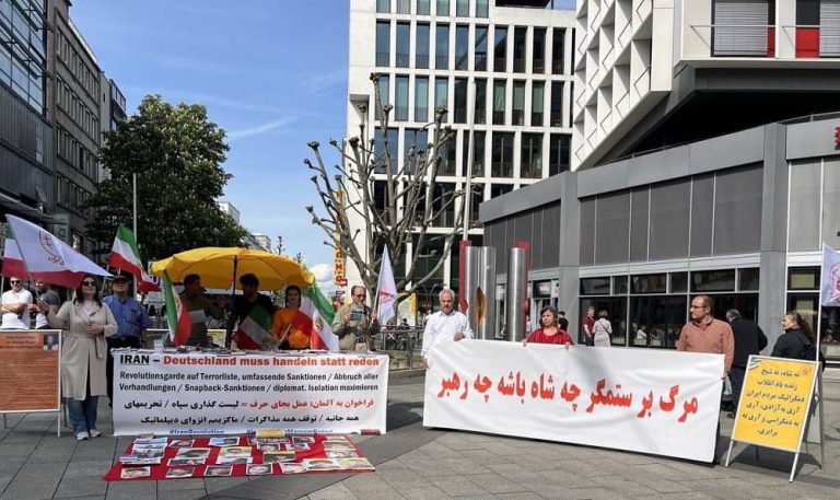 Stuttgart, Germany—May 6, 2023: Freedom-loving Iranians and supporters of the People's Mojahedin Organization of Iran (PMOI/MEK) held a rally in solidarity with the Iranian Revolution.