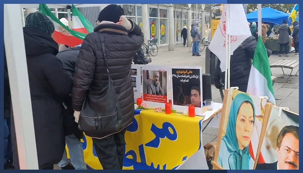 Heidelberg, Germany—December 2, 2023: Freedom-loving Iranians and supporters of the People’s Mojahedin Organization of Iran (PMOI/MEK) organized an exhibition to support the Iranian Revolution. They also condemned the wave of brutal executions in Iran.