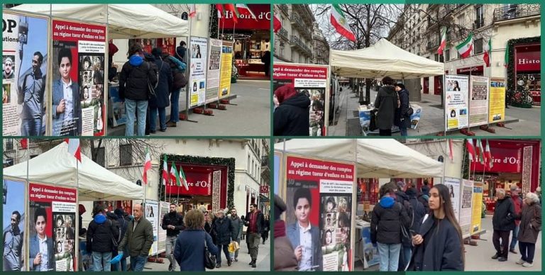 Paris—December 14, 2023: Exhibition on Rue de Rivoli aims to protest the escalating wave of executions in Iran, highlighting the oppressive rule of the mullahs' regime and condemning Raisi, who is implicated in the 1988 massacre and is the murderer of the Iranian people.