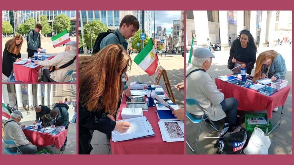 Manchester—June 8, 2024: Freedom-loving Iranians and academics living in England, supporters of the People's Mojahedin Organization of Iran (PMOI/MEK), organized a book exhibition and petition collection to back the Iranian Revolution.