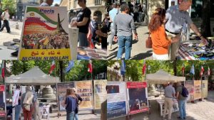 Book stall and photo exhibition in Paris commemorating executed political prisoners and promoting a democratic future for Iran.