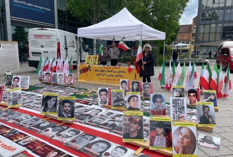 MEK supporters hold an exhibition in Achern protesting executions in Iran.