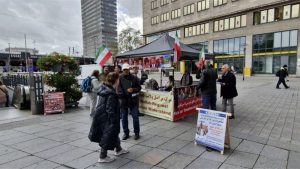 MEK supporters hold an exhibition in Essen protesting executions in Iran and promoting the June 20 Paris rally for democratic change.