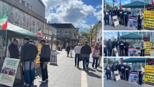 Kiel, Germany — May 9, 2026: MEK supporters held a book stall to protest executions in Iran and call for a democratic republic.