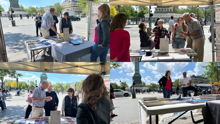 At a bookstall and photo exhibition in Paris, supporters of the PMOI/MEK denounce executions in Iran and call for a democratic republic ahead of the June 20 rally.