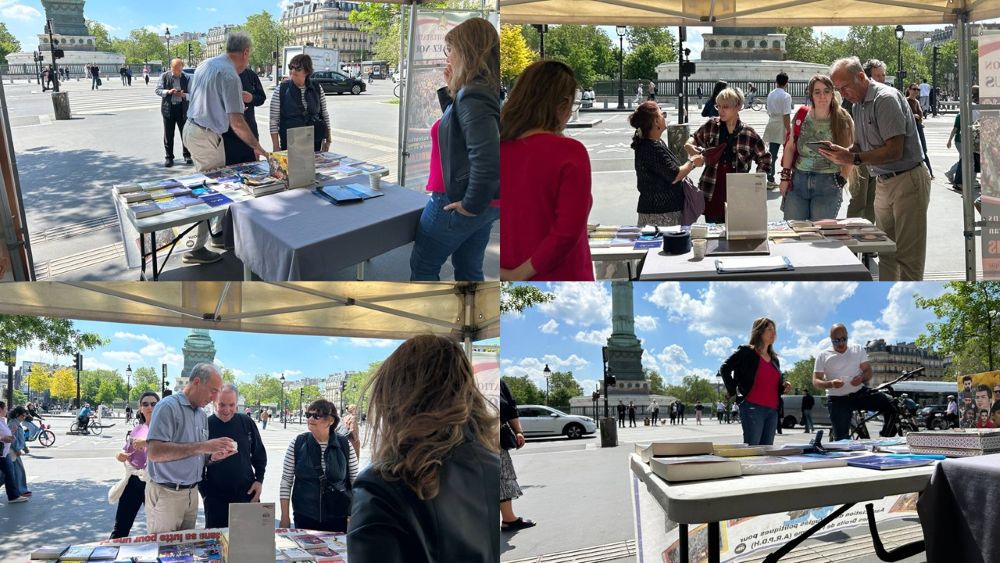 At a bookstall and photo exhibition in Paris, supporters of the PMOI/MEK denounce executions in Iran and call for a democratic republic ahead of the June 20 rally.