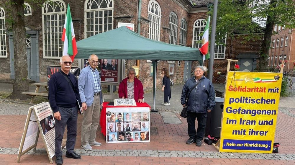 MEK supporters held a book table in Elmshorn, calling for mass participation in the June 20 Free Iran gathering in Paris.