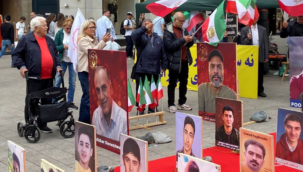 MEK supporters in Hamburg protest executions and promote the June 20 Free Iran rally in Paris.