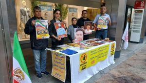 MEK supporters in Lugano protest executions and promote the June 20 Free Iran rally in Paris.