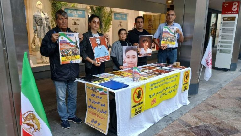 MEK supporters in Lugano protest executions and promote the June 20 Free Iran rally in Paris.
