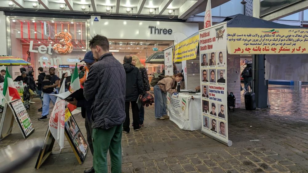 Book table and photo exhibition in Manchester highlights Iran’s executions and human rights abuses.