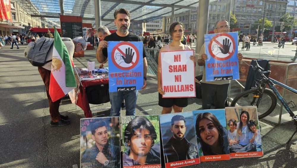 PMOI/MEK supporters in Bern hold a rally and photo exhibition against executions in Iran.