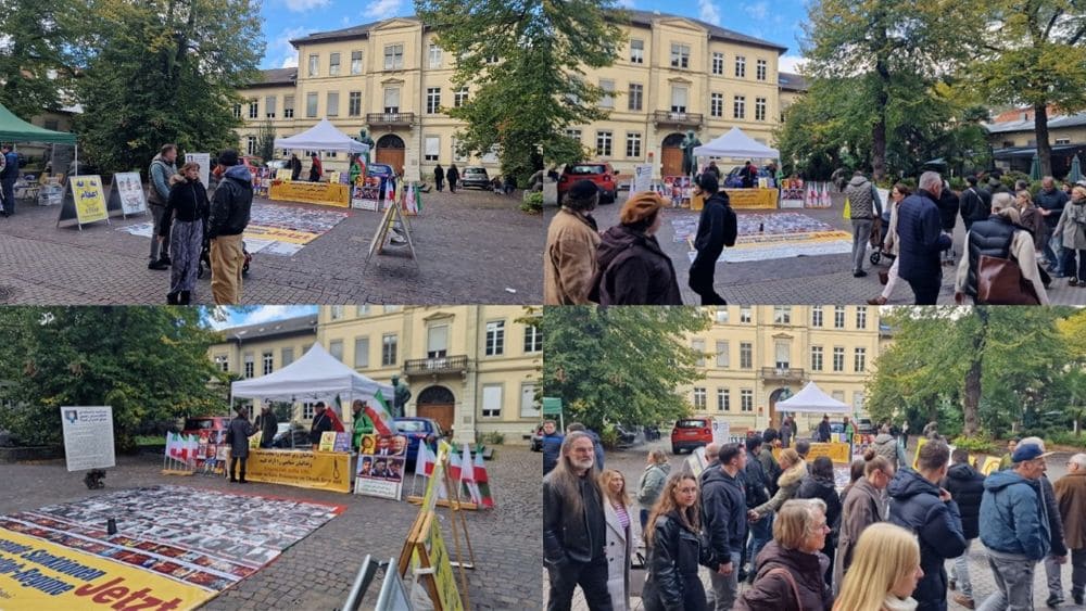 PMOI supporters held a book table and photo exhibition in Heidelberg to protest executions in Iran.