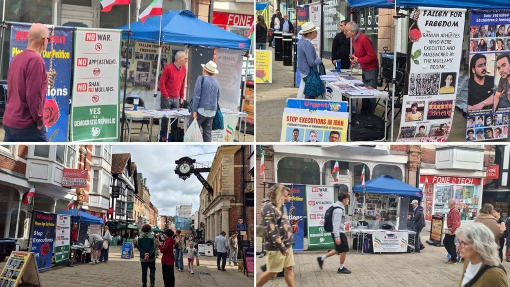 Academics in Exile members hold a book table and photo exhibition in Winchester highlighting Iran’s human rights abuses.